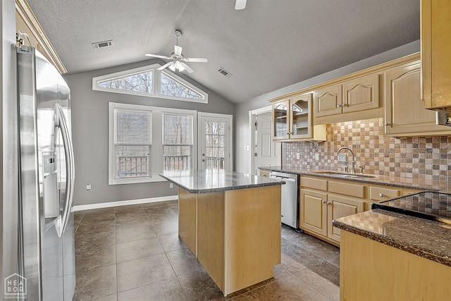 2101 Belleview Cv, Jonesboro, AR 72404 - kitchen with visible vents, a sink, ceiling fan, appliances with stainless steel finishes, and decorative backsplash