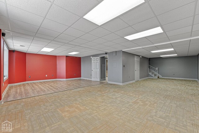2101 Belleview Cv, Jonesboro, AR 72404 - spare room with stairs, carpet flooring, baseboards, and a drop ceiling