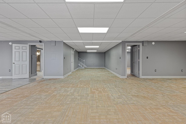 2101 Belleview Cv, Jonesboro, AR 72404 - finished basement featuring light carpet, stairs, a paneled ceiling, and baseboards
