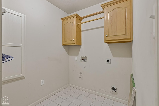 2101 Belleview Cv, Jonesboro, AR 72404 - laundry area with light tile patterned floors, baseboards, cabinet space, electric dryer hookup, and hookup for a washing machine