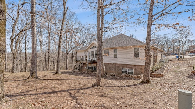 2101 Belleview Cv, Jonesboro, AR 72404 - back of property with stairway, a deck, and a shingled roof
