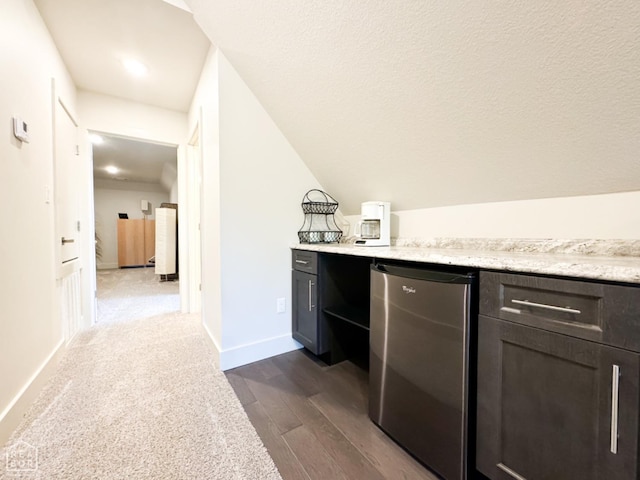 3997 Hwy 351, Jonesboro, AR 72405 - indoor dry bar with freestanding refrigerator, dark wood-style flooring, and baseboards