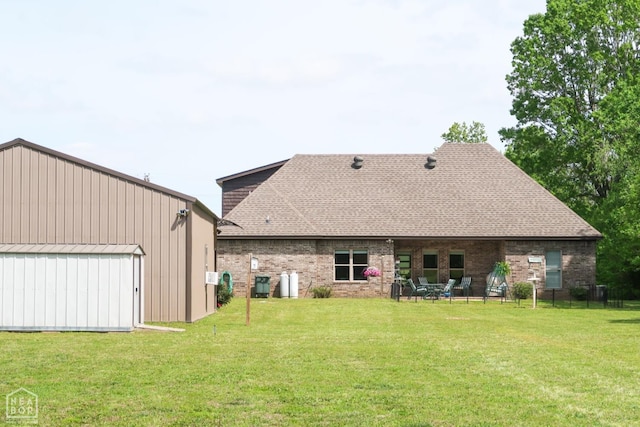 3997 Hwy 351, Jonesboro, AR 72405 - rear view of property with a lawn, an outbuilding, and brick siding