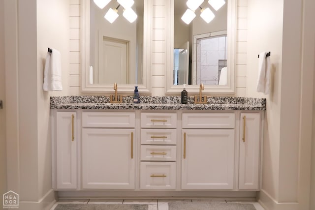 3997 Hwy 351, Jonesboro, AR 72405 - bathroom featuring double vanity, baseboards, and tile patterned floors