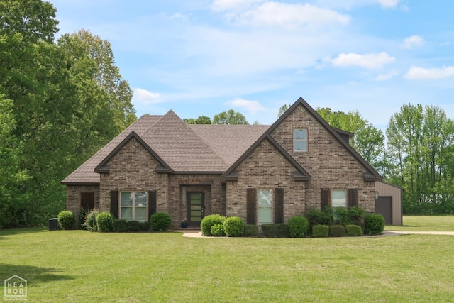 3997 Hwy 351, Jonesboro, AR 72405 - view of front of house with brick siding, a garage, a front yard, a shingled roof, and driveway