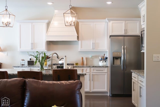 3997 Hwy 351, Jonesboro, AR 72405 - kitchen with stainless steel fridge with ice dispenser, a chandelier, custom range hood, white cabinets, and recessed lighting