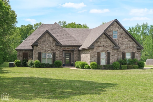 3997 Hwy 351, Jonesboro, AR 72405 - view of front of home featuring brick siding, a front yard, and roof with shingles