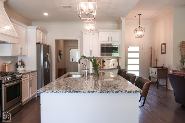 3997 Hwy 351, Jonesboro, AR 72405 - kitchen with appliances with stainless steel finishes, a sink, wall chimney exhaust hood, a chandelier, and recessed lighting