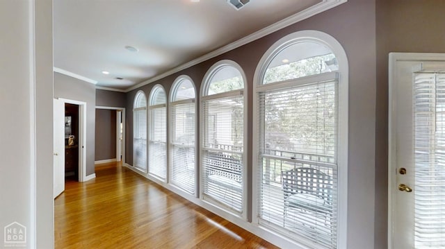 3102 Sara Creek Dr, Jonesboro, AR 72401 - corridor featuring wood finished floors and ornamental molding