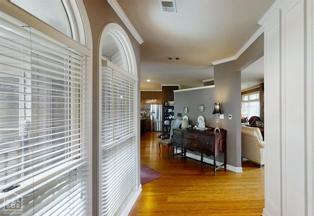 3102 Sara Creek Dr, Jonesboro, AR 72401 - hallway featuring ornamental molding and light wood-style flooring