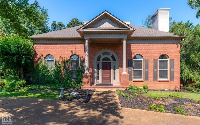 3102 Sara Creek Dr, Jonesboro, AR 72401 - greek revival inspired property featuring brick siding, a chimney, and a shingled roof