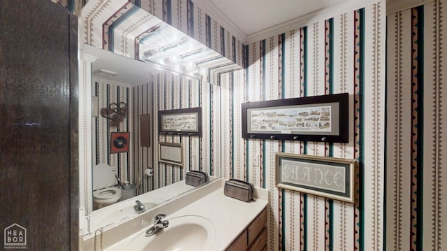 3102 Sara Creek Dr, Jonesboro, AR 72401 - bathroom featuring wallpapered walls, vanity, and crown molding