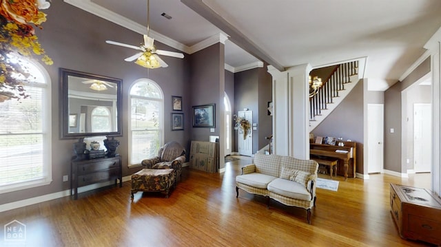 3102 Sara Creek Dr, Jonesboro, AR 72401 - sitting room with wood finished floors, stairway, healthy amount of natural light, and crown molding