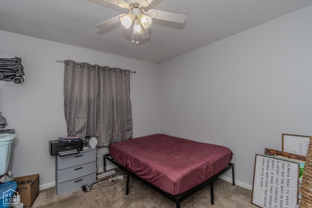 bedroom featuring baseboards, a ceiling fan, and carpet