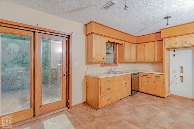 812 Glendale St, Jonesboro, AR 72401 - kitchen featuring a sink, dishwasher, light countertops, and a textured ceiling