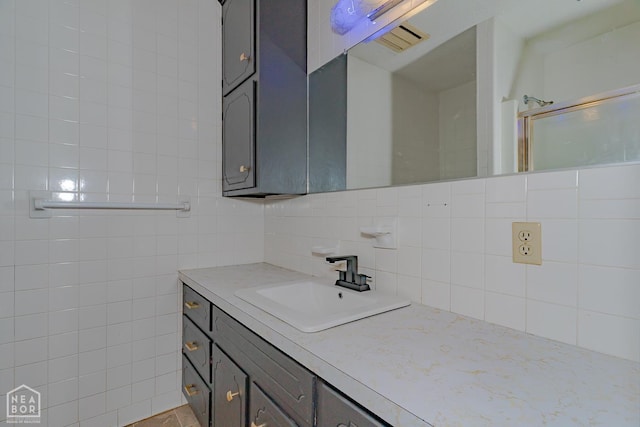 812 Glendale St, Jonesboro, AR 72401 - full bath featuring vanity, tasteful backsplash, and tile walls