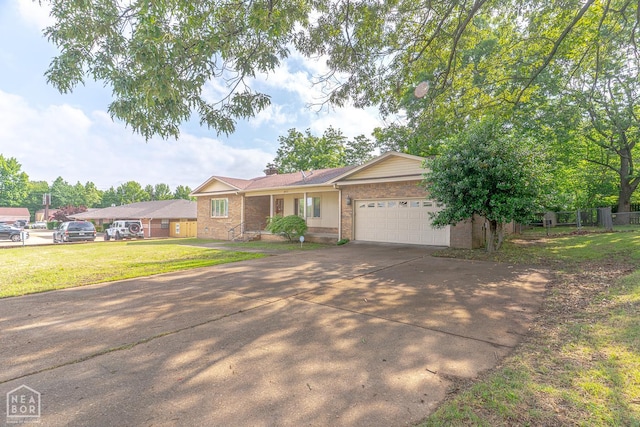 812 Glendale St, Jonesboro, AR 72401 - ranch-style home with brick siding, concrete driveway, and an attached garage