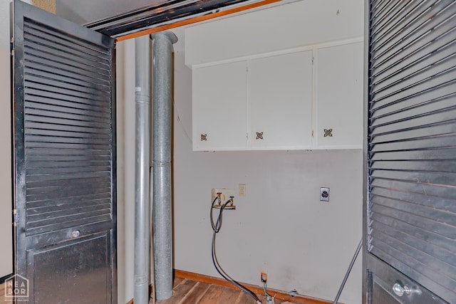 812 Glendale St, Jonesboro, AR 72401 - laundry room featuring electric dryer hookup, cabinet space, hookup for a washing machine, and wood finished floors