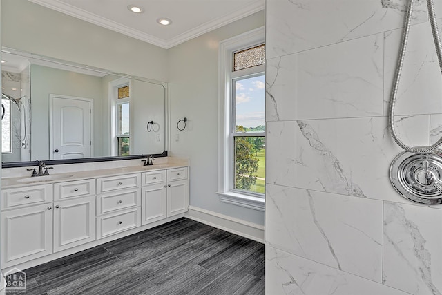 4217 Lochmoor Cir, Jonesboro, AR 72405 - bathroom featuring double vanity, a shower, crown molding, recessed lighting, and baseboards