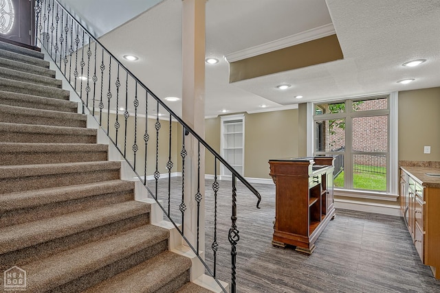4217 Lochmoor Cir, Jonesboro, AR 72405 - stairway featuring ornamental molding, baseboards, wood finished floors, and recessed lighting