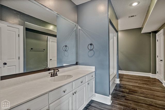 4217 Lochmoor Cir, Jonesboro, AR 72405 - bathroom with vanity, wood finished floors, and baseboards
