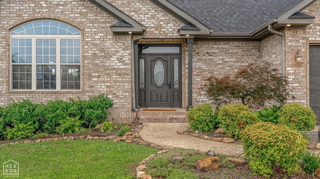 4217 Lochmoor Cir, Jonesboro, AR 72405 - view of exterior entry featuring roof with shingles and brick siding