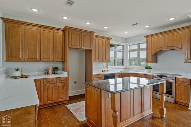 4217 Lochmoor Cir, Jonesboro, AR 72405 - kitchen with stainless steel electric stove, a sink, brown cabinets, dark wood-style floors, and black dishwasher