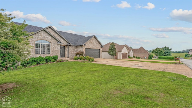 4217 Lochmoor Cir, Jonesboro, AR 72405 - french country style house with concrete driveway, brick siding, a front yard, an attached garage, and a shingled roof