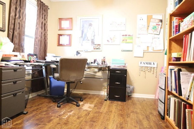 office area with baseboards and wood finished floors