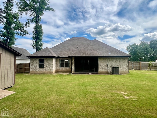 5204 Bridger Park Ct, Jonesboro, AR 72405 - rear view of property with a fenced backyard, brick siding, and roof with shingles