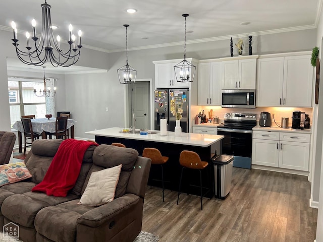 5204 Bridger Park Ct, Jonesboro, AR 72405 - kitchen with appliances with stainless steel finishes, open floor plan, a chandelier, light countertops, and dark wood-style floors