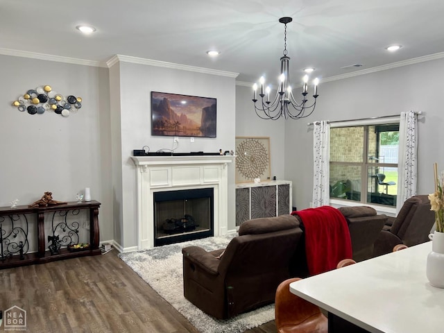 5204 Bridger Park Ct, Jonesboro, AR 72405 - living room with dark wood-type flooring, a chandelier, ornamental molding, a fireplace, and recessed lighting
