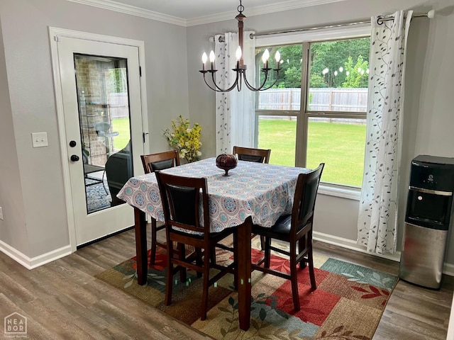 5204 Bridger Park Ct, Jonesboro, AR 72405 - dining room featuring wood finished floors, a chandelier, and ornamental molding