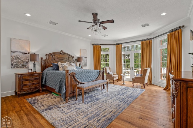 3500 Big Creek Cv, Jonesboro, AR 72404 - bedroom with access to outside, light wood-style flooring, ornamental molding, french doors, and a textured ceiling
