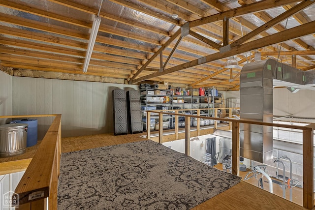 3500 Big Creek Cv, Jonesboro, AR 72404 - kitchen featuring wood walls, lofted ceiling, and wood finished floors