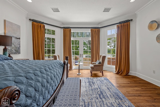 3500 Big Creek Cv, Jonesboro, AR 72404 - bedroom with french doors, wood finished floors, crown molding, and recessed lighting
