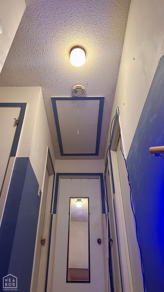 1703 W Oak Ave, Jonesboro, AR 72401 - corridor featuring a textured ceiling