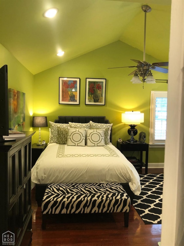 bedroom featuring lofted ceiling and wood finished floors
