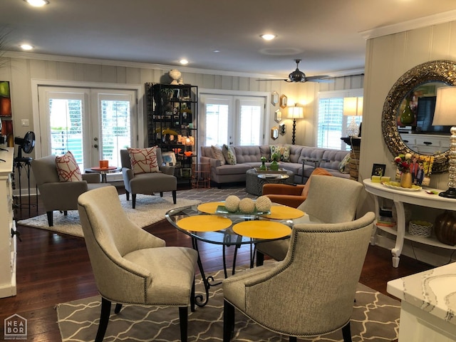 dining space featuring recessed lighting, a decorative wall, crown molding, and dark wood-type flooring