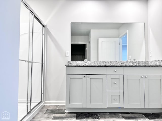 112 Terry Dr, Brookland, AR 72417 - full bathroom with a stall shower, double vanity, and baseboards