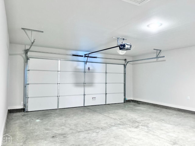 112 Terry Dr, Brookland, AR 72417 - garage featuring a garage door opener and baseboards