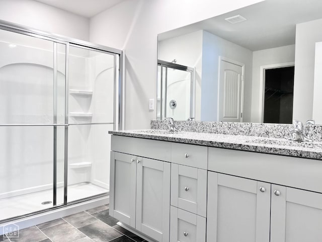 112 Terry Dr, Brookland, AR 72417 - full bath featuring a stall shower, double vanity, and a closet