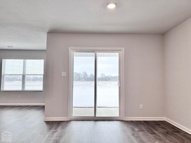 112 Terry Dr, Brookland, AR 72417 - unfurnished room with dark wood-type flooring and baseboards