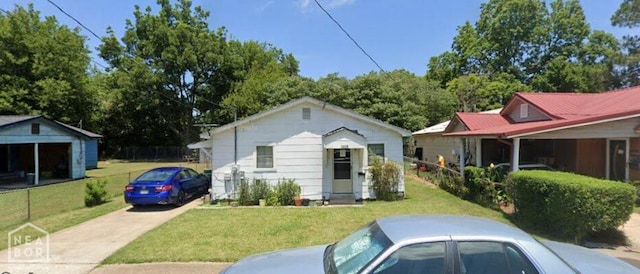 1610 Harmon St, Blytheville, AR 72315 - bungalow with a front lawn and an outbuilding