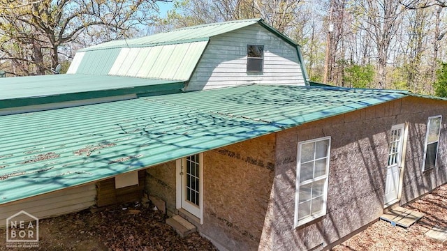 view of property exterior featuring a gambrel roof