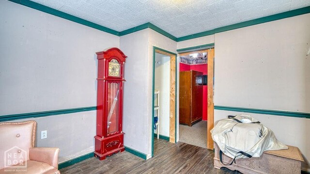 interior space with wood finished floors and baseboards