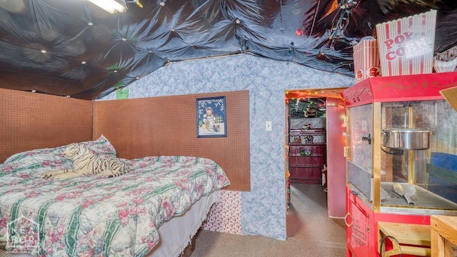 carpeted bedroom with lofted ceiling