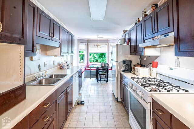 304 E Ridge Dr, West Helena, AR 72390 - kitchen featuring white appliances, under cabinet range hood, a sink, light countertops, and light tile patterned floors