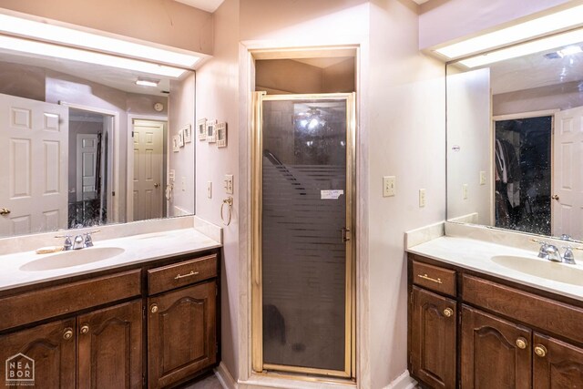 304 E Ridge Dr, West Helena, AR 72390 - bathroom featuring a shower stall and two vanities