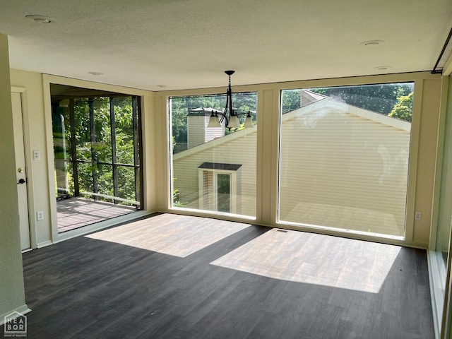 1804 Deerwood Dr, Jonesboro, AR 72404 - unfurnished dining area with wood finished floors, healthy amount of natural light, and a chandelier